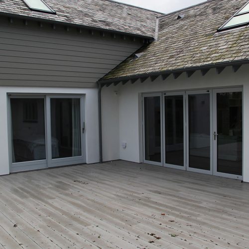 Grey bifold doors and sliding patio doors