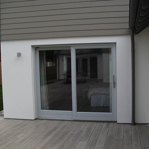 Grey sliding patio door installation