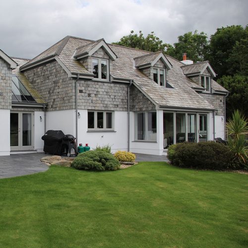 Grey uPVC flush sash windows and bifold doors